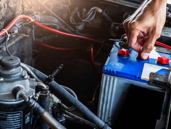 Hand worker service check car battery